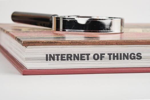 The concept of technology and development. Phrase, words, text INTERNET OF THINGS on the end of the book, a close-up front view photo