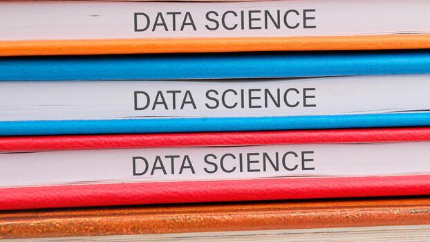 The concept of technology and development. Phrase, words, text DATA SCIENCE close-up on the ends of the notebooks photo