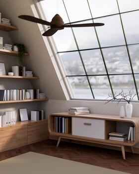 A wooden table with drawer under roof window and next to a bookshelf in a room with ceiling fan photo