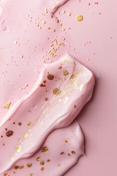 This scene features a soft pink background adorned with delicate gold dots. The smooth texture of the pink paint swirls gracefully, creating an artistic and calming effect photo