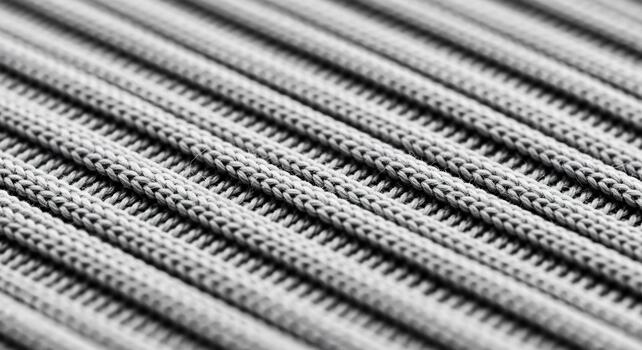 Closeup of a textured gray fabric with parallel lines creating a repetitive pattern and abstract background. photo