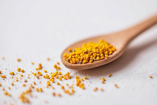 Pollen on a wooden spoon showcased in studio lighting for product display photo