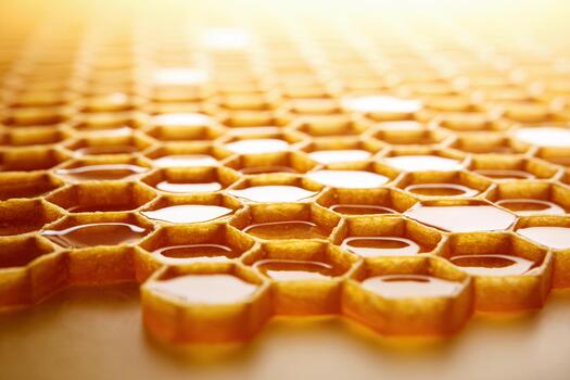 Honeycomb pattern displayed on a clean glass surface with minimalist style photo