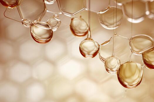 Close-up view of honey droplets on a honeycomb surface in natural light photo