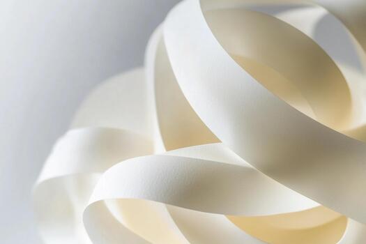 Sculptural arrangement of white ribbons creating an elegant display design photo