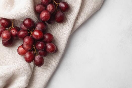 Grapes on soft linen cloth, showcasing minimalist design with an elegant touch photo