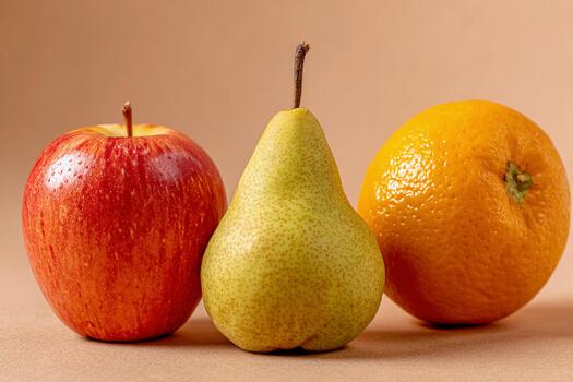 Fresh fruits including apple, pear, and orange presented in a still life setting photo