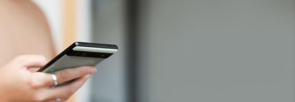 A person is intensely scrolling on a smart phone. feed of bad media news. The banner is designed with clear copy space. smart phone scrolling anxiety banner copy space photo