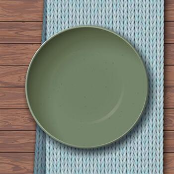 Top view of empty green bowl with grainy texture placed on a light blue placemat on a wooden table vector