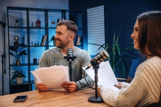 Podcast hosts in a modern studio photo