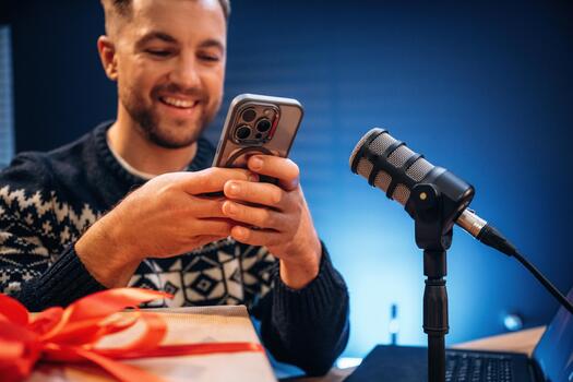 Man with smartphone and microphone photo