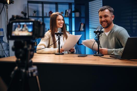 Podcast hosts in a modern studio photo