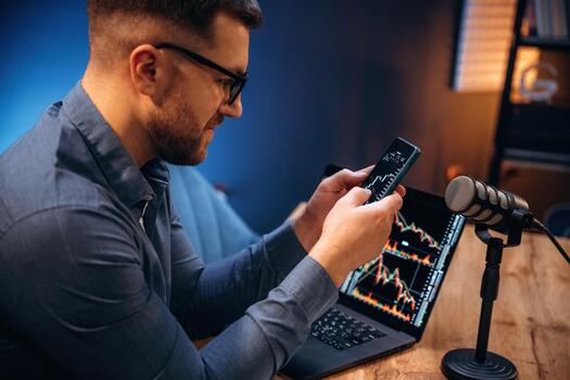 Man checking stock data on smartphone photo