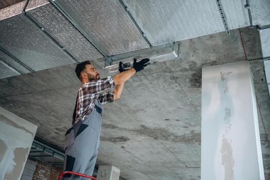 Man installing ceiling insulation photo