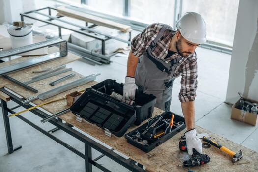 Construction worker at a tool table photo