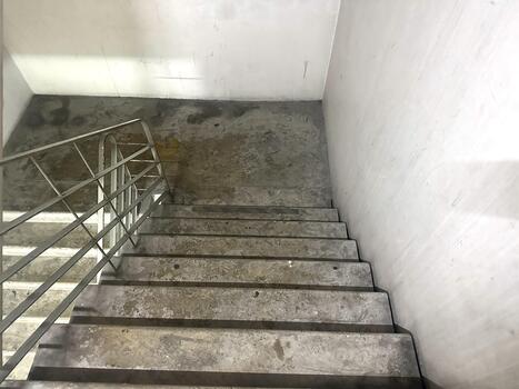 Concrete Staircase with Steel Railing in an Industrial Setting, Highlighting Texture and Minimalist Design for Architectural Photography photo