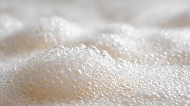 Close-up of creamy white bubbles creating a soft, textured surface, evoking a sense of calm and serenity. photo
