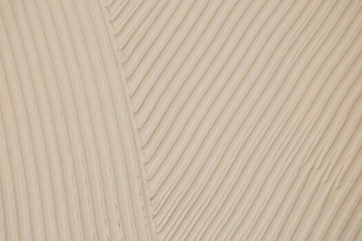 Close view of textured surface with parallel lines and light color photo