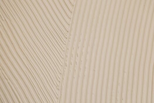 Patterned texture on a wall showing lines and curves created by design elements photo