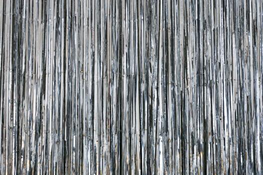 Shiny metallic surface with vertical stripes creating an abstract pattern in bright light photo