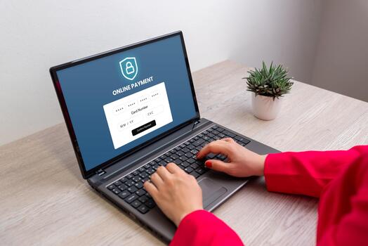 Hands typing on laptop showing online payment form with credit card fields, concept of digital transaction, secure finance, and e-commerce technology photo