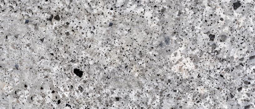 Polished granite surface with natural speckled pattern photo