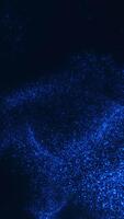 Vertical blue particle cloud expanding and dispersing into dark digital space. Glowing futuristic motion effect with immersive dust flow. video