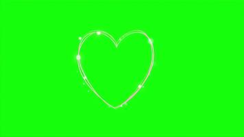 animerad lysande hjärta form med gnistrande partiklar på en grön skärm bakgrund. video