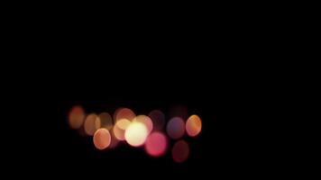 Abstract Bokeh Lights Transition Effect, Blurry Circles of Warm Colors on Black Background video