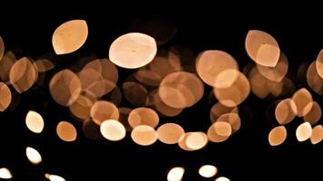 oro bokeh ligero resumen con suave brillante partículas y elegante festivo iluminación video