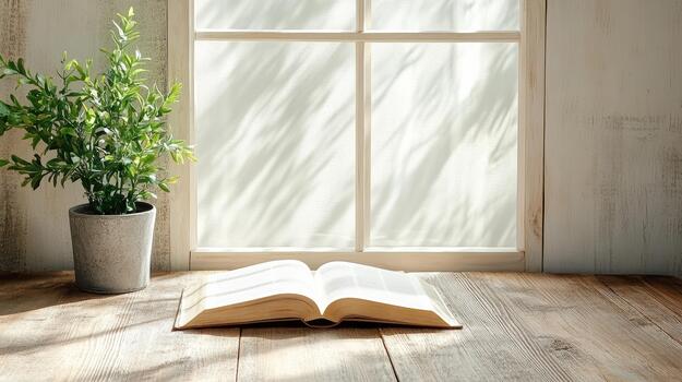 Open book on wooden table near window photo