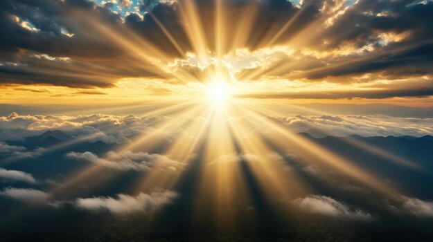 The sun shines through clouds over a mountain range photo