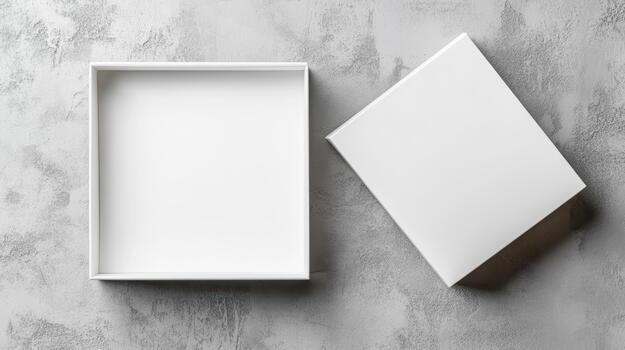 Two empty white boxes on a concrete wall photo