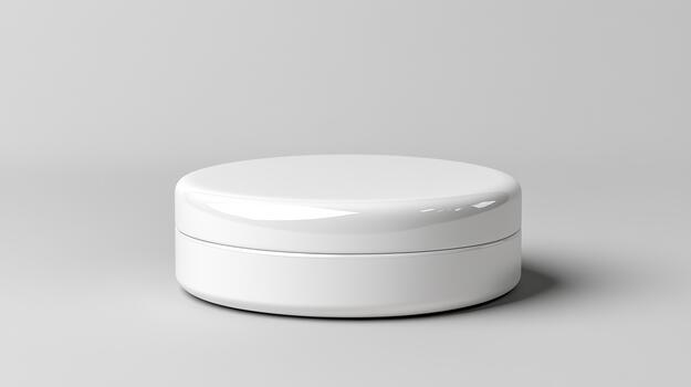 A white container with a lid on a gray surface photo