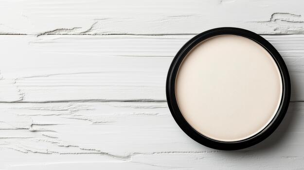 An empty round mirror on a white wooden table photo