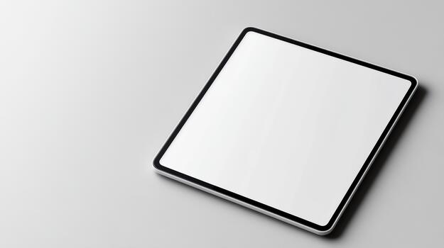 An empty white tablet on a table photo