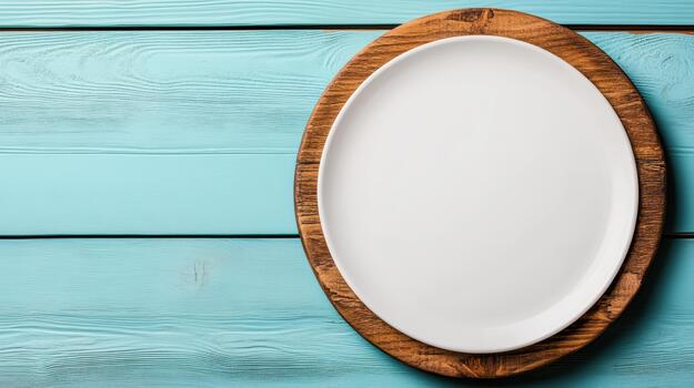 White plate on wooden table top view photo