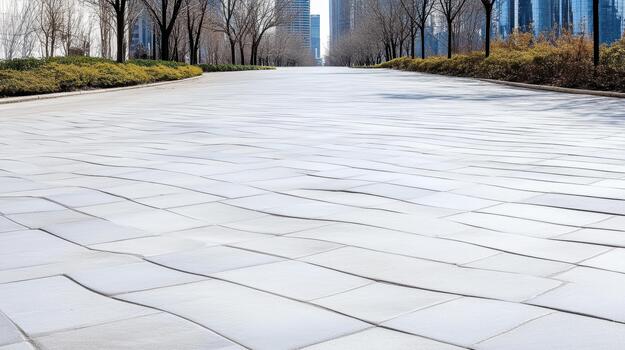 A paved road with trees and buildings in the background photo