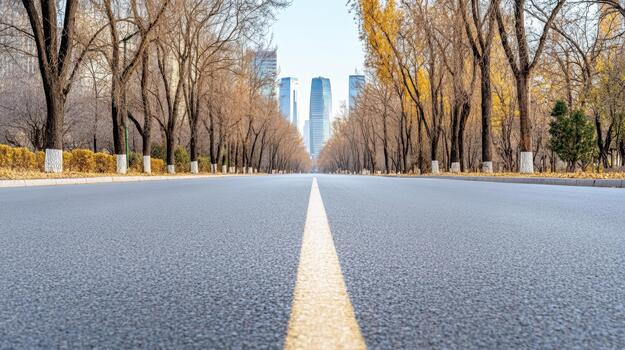 Empty road with trees and buildings in the background photo
