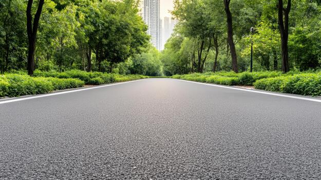 An empty road with trees and buildings in the background photo