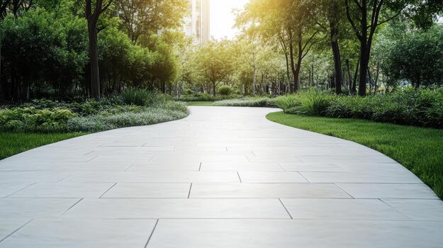 A walkway in a park with trees and grass photo