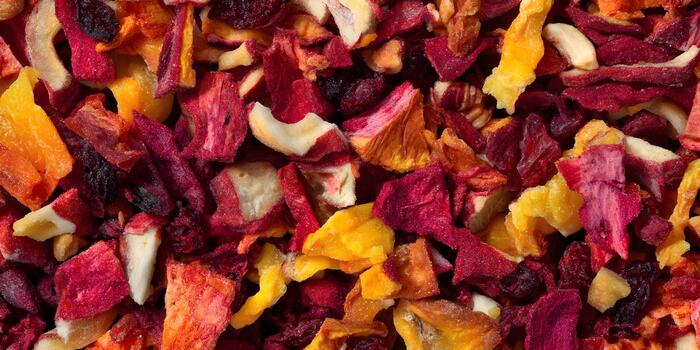 A vibrant close up texture features a colorful mix of various dried fruits and vegetables creating an inviting and healthy background photo