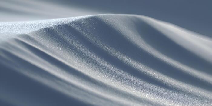 A macro view of shimmering subtle waves creating a serene abstract pattern in cool blue tones photo