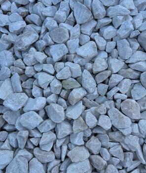 Pattern of white gravel with a uniform, clean texture. lose-up view of small, smooth gravel stones arranged in a seamless, repeating design. Ideal for backgrounds, surfaces, and abstract designs. photo