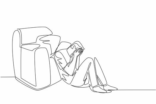 Continuous one line drawing man sitting on floor leaning on single sofa, cover face with both palms. Layoff. No income. Sad. National Anxiety Screening Day. Single line draw design illustration vector