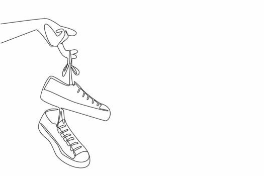 Single continuous line drawing a pair of sneakers with laces hanging from the fingers. Easy to carry. Attracts attention. National Two Different Colored Shoes Day. One line design vector