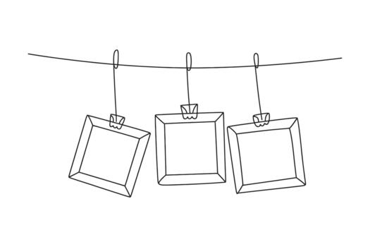 Simple hand drawn sketch of three empty photo frames hanging on a clothesline vector