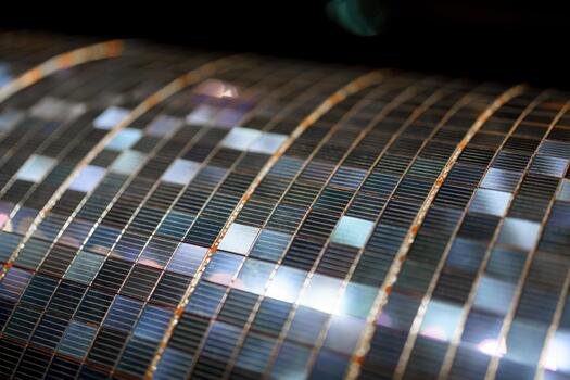 High-tech solar panel surface showcasing intricate photovoltaic cells and design patterns in a close-up view photo