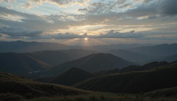 Beautiful Sunset Over the Mountain Range With Layers of Hills and Clouds at Dusk photo