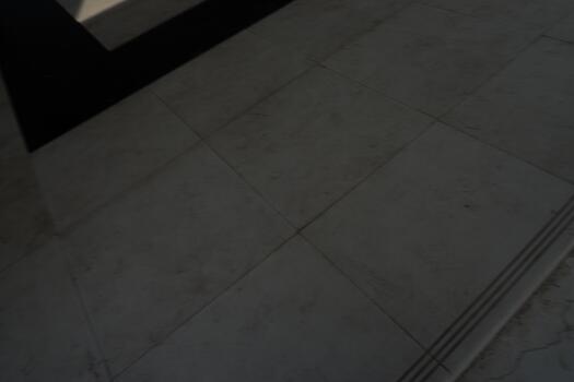 Textured Stone Floor with Black Border Detail, Elegant Surface for Architecture photo